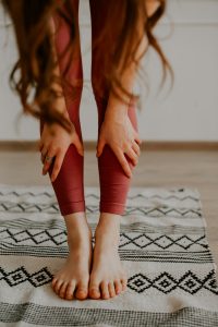 A woman bent over in discomfort