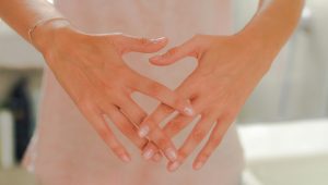 hands in front of pelvis